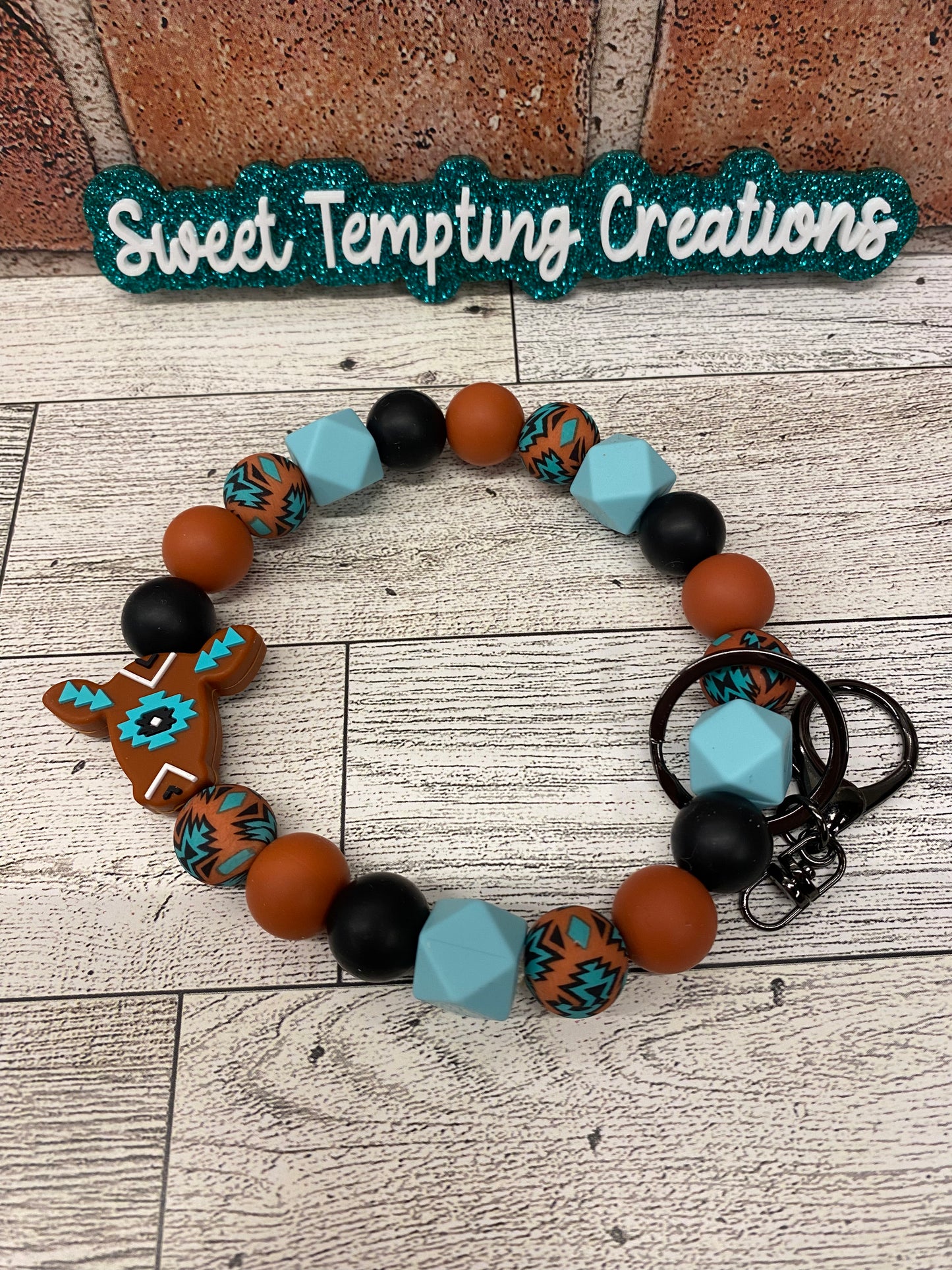 Rust Aztec Cow silicone wristlet keychain